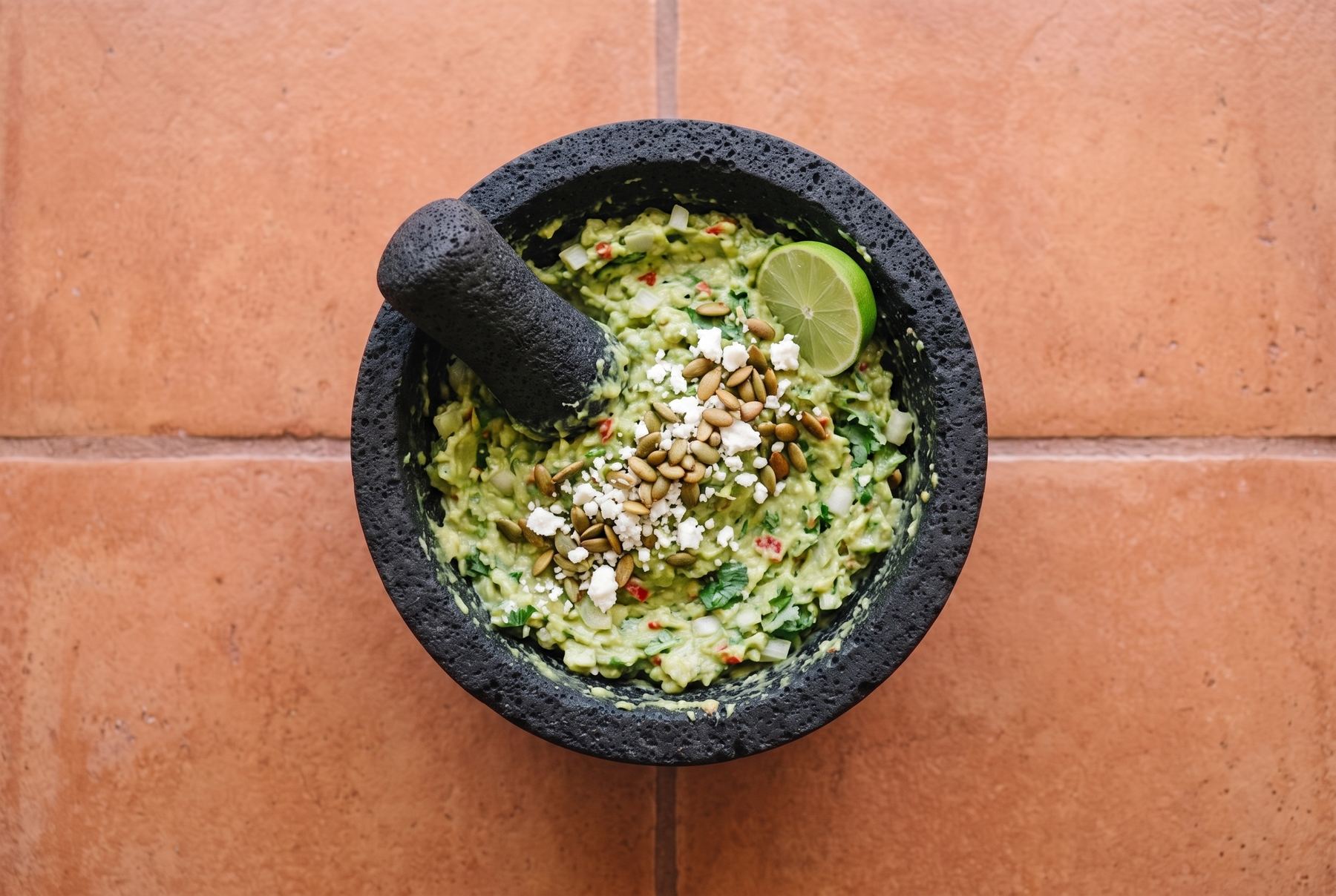 The same molcajete, now full of finished guacamole.